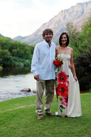 11. Chris and Rena on their wedding day with a trout stream flowing in the background