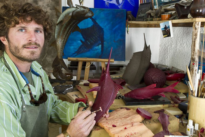 25. At work on a wax mould of a sailfish in his Kalk Bay studio